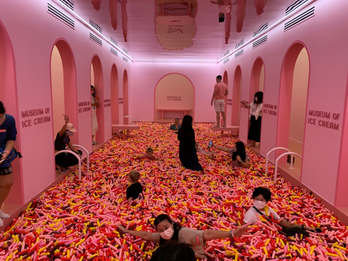 Visitors play in a 'sprinkle pool' at the Museum of Ice Cream in Singapore, August 19, 2021. REUTERS/Travis Teo
