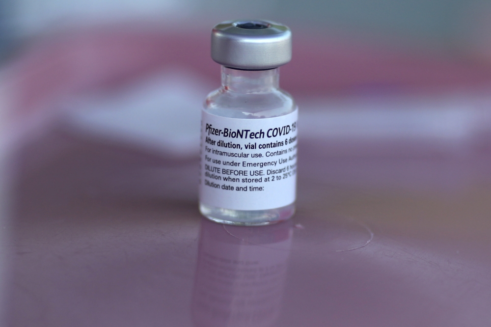 A Pfizer-BioNTech coronavirus disease (COVID-19) vaccination is seen as part of a vaccine drive by the Fernandeno Tataviam Band of Mission Indians in Arleta, Los Angeles, California, U.S., August 23, 2021. REUTERS/Lucy Nicholson