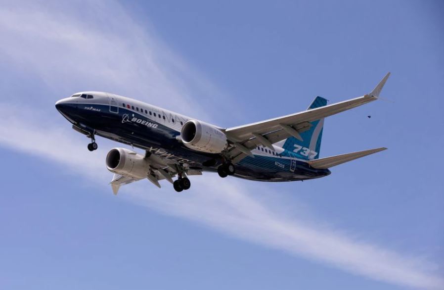 A Boeing 737 MAX airplane lands after a test flight at Boeing Field in Seattle, Washington, U.S. June 29, 2020. REUTERS/Karen Ducey/File Photo

