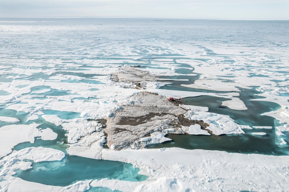 An undated handout image with a view of a tiny island off the coast of Greenland, discovered during the Leister Expedition, which they say is the world's northernmost point of land. Julian Charriere/via REUTERS