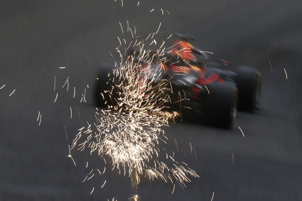 Sparks are seen from the car of Red Bull's Max Verstappen during practice REUTERS/Christian Hartmann