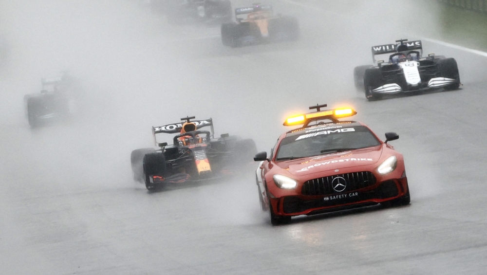 General view of the safety car and drivers as the start of the race is delayed due to bad weather REUTERS/Christian Hartmann