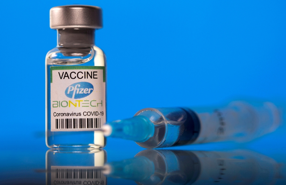 A vial labelled with the Pfizer-BioNTech coronavirus disease (COVID-19) vaccine is seen in this illustration picture taken March 19, 2021. REUTERS/Dado Ruvic/Illustration/File Photo/File Photo