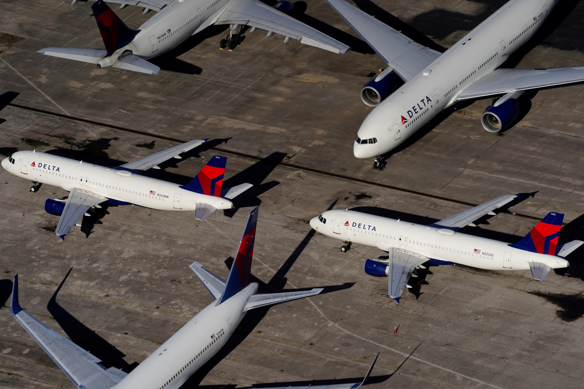 FILE PHOTO: Delta Air Lines passenger planes are seen parked due to flight reductions made to slow the spread of coronavirus disease (COVID-19), at Birmingham-Shuttlesworth International Airport in Birmingham, Alabama, U.S. March 25, 2020. REUTERS/Elijah 