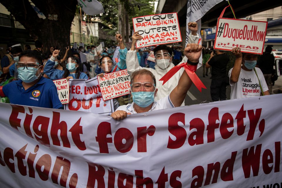 Healthcare workers hold a protest outside the Philippines' health department, demanding better wages and benefits amid rising coronavirus disease (COVID-19) infections, in Manila, Philippines, September 1, 2021. REUTERS/Eloisa Lopez
