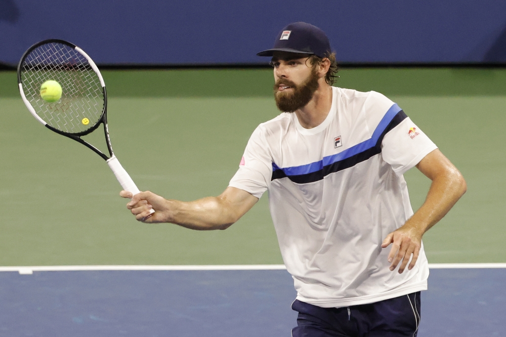 Reilly Opelka of the United States hits a volley against Nikoloz Basilashvili of Georgia (not pictured) on day six of the 2021 U.S. Open tennis tournament. Geoff Burke-USA TODAY Sports