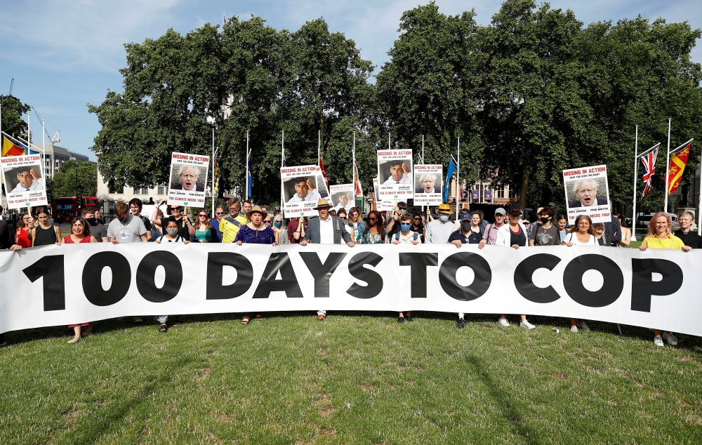 File photo: Protesters from the Climate Coalition demonstrate, with 100 hundred days to go before the start of the COP26 climate summit, in Parliament Square, London, Britain, July 23, 2021. Reuters/Peter Nicholls/File Photo