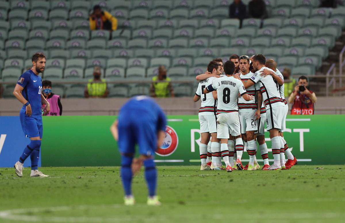 Soccer Football - World Cup - UEFA Qualifiers - Group A - Azerbaijan v Portugal - Baku Olympic Stadium, Baku, Azerbaijan - September 7, 2021 Portugal's Bernardo Silva celebrates scoring their first goal with Joao Cancelo and teammates REUTERS/Aziz Karimov