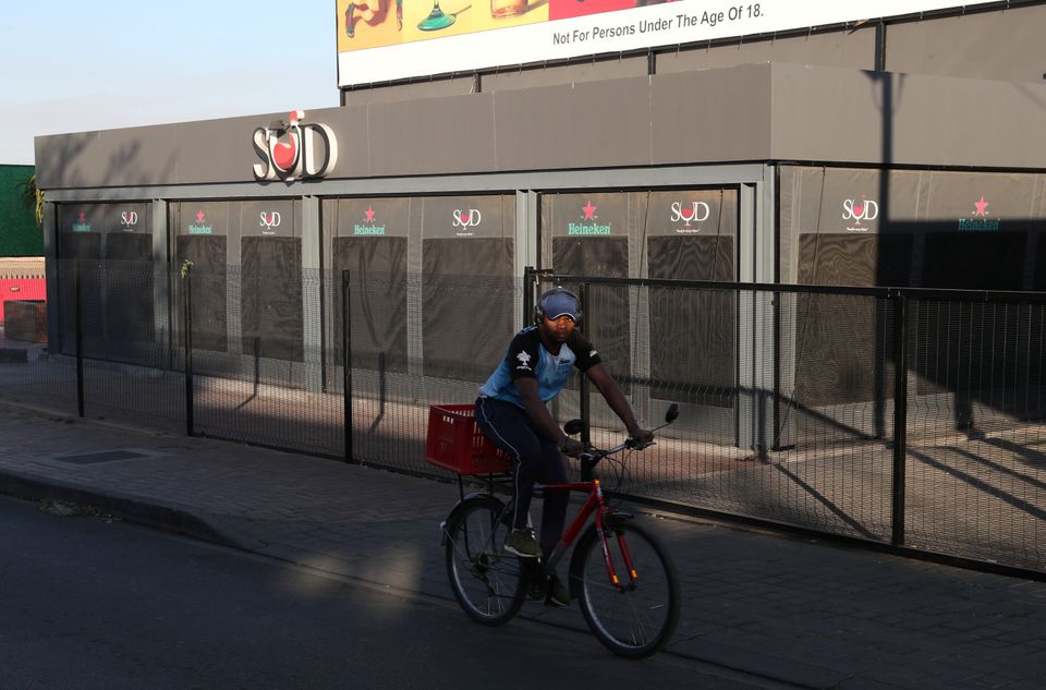 A man cycles past a restaurant closed during the coronavirus disease (COVID-19) outbreak as the country faces tougher lockdown restrictions in Soweto, South Africa, June 28, 2021. REUTERS/Siphiwe Sibeko