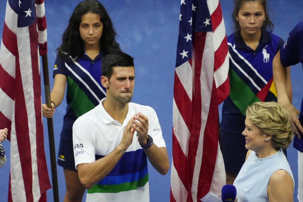 Novak Djokovic of Serbia (L) is overcome with emotion during an interview at USTA Billie Jean King National Tennis Center. Robert Deutsch-USA TODAY Sports