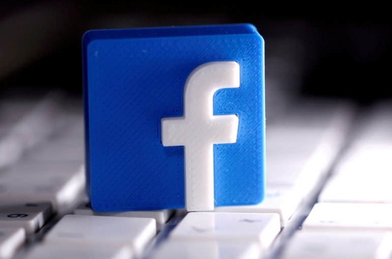 FILE PHOTO: A 3D-printed Facebook logo is seen placed on a keyboard in this illustration taken March 25, 2020. REUTERS/Dado Ruvic/Illustration