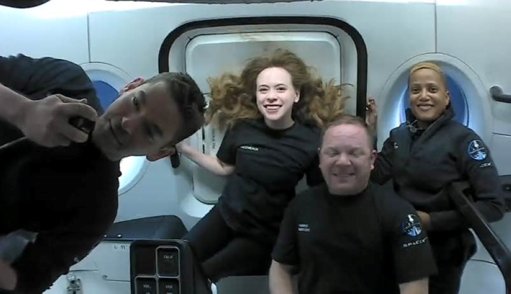 Inspiration4 crew Jared Isaacman, Sian Proctor, Hayley Arceneaux, and Chris Sembroski, seen on their first day in space in this handout photo released on September 17, 2021. SpaceX/Handout via Reuters