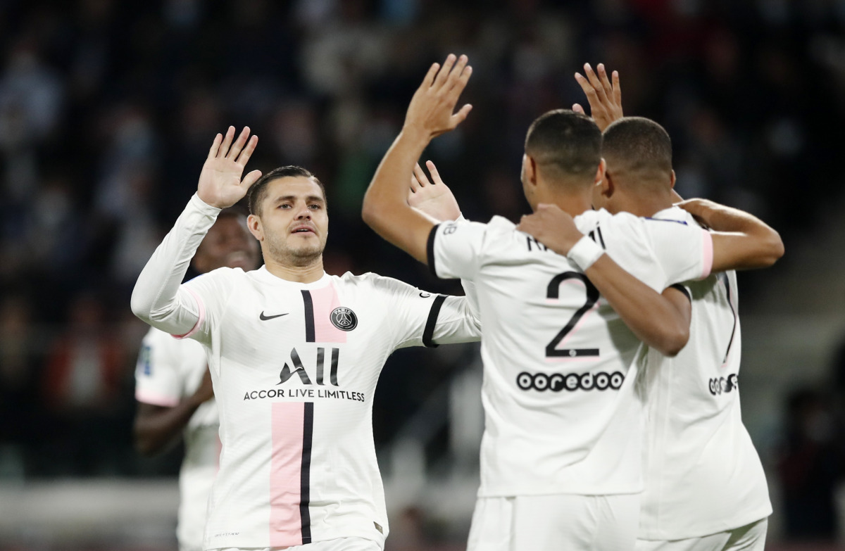 Paris St Germain's Achraf Hakimi celebrates scoring their first goal with teammates REUTERS/Benoit Tessier
