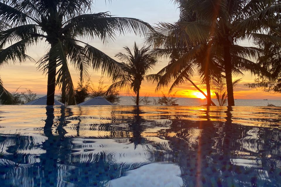 A sunset is seen in a resort after the Vietnamese government eased the lockdown following the coronavirus disease (COVID-19) outbreak, in Phu Quoc island, Vietnam May 8, 2020. REUTERS/James Pearson

