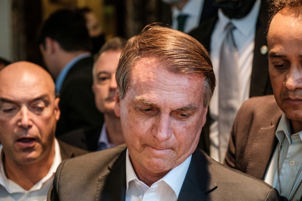 Brazil's President Jair Bolsonaro greets supporters outside his hotel during the 76th Session of the U.N. General Assembly in New York, U.S., September 21, 2021. REUTERS/Stephen Yang/File Photo