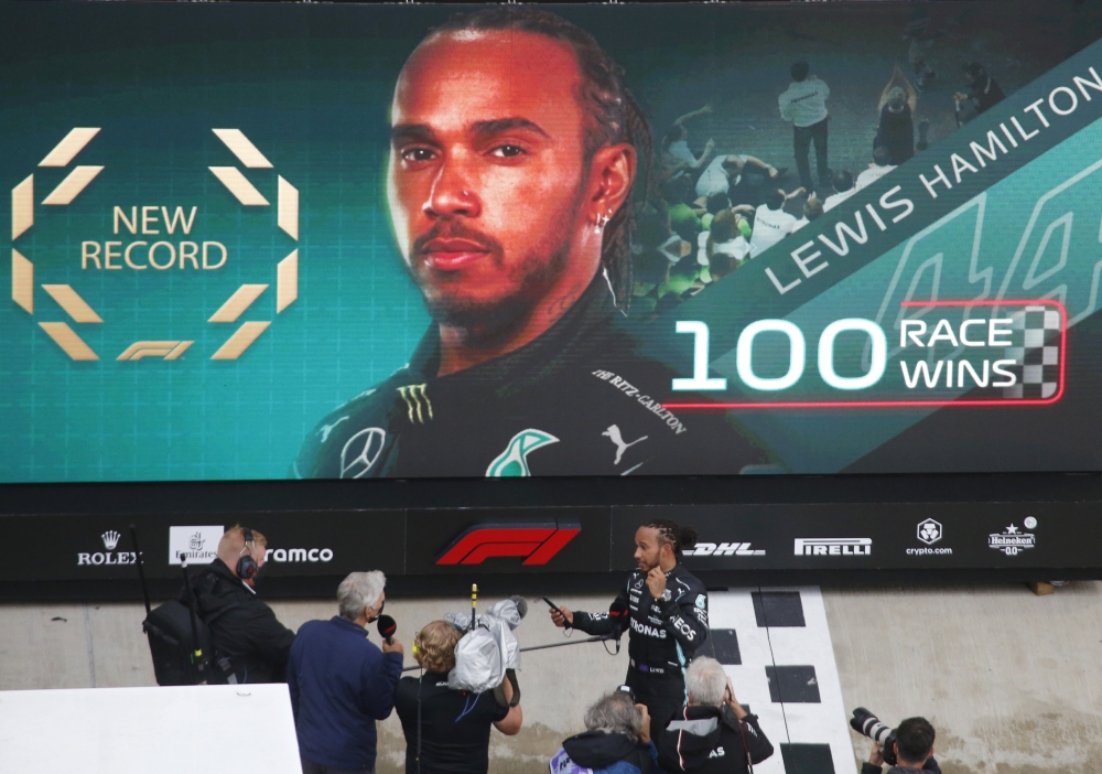 Mercedes' Lewis Hamilton is interviewed after winning his 100th race REUTERS/Anton Vaganov