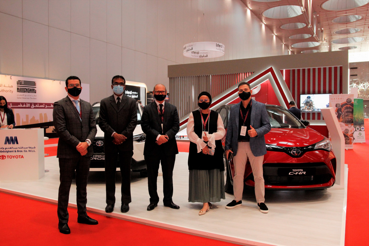 Officials pose for a group photo during the 3rd Majd Qatar Exhibition & Forum.