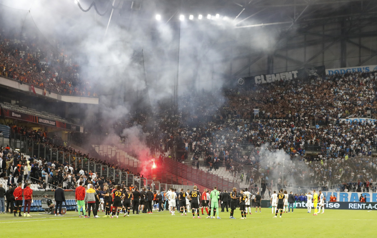 The match is stopped as Galatasaray fans clash with police REUTERS/Eric Gaillard

