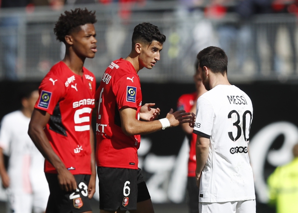Paris Saint-Germain's Lionel Messi shakes hands with Stade Rennais' Nayef Aguerd after the match REUTERS/Stephane Mahe