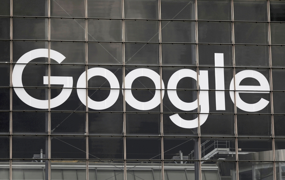 The logo of Google is seen on a building at La Defense business and financial district in Courbevoie near Paris, France, September 1, 2020. REUTERS/Charles Platiau/File Photo