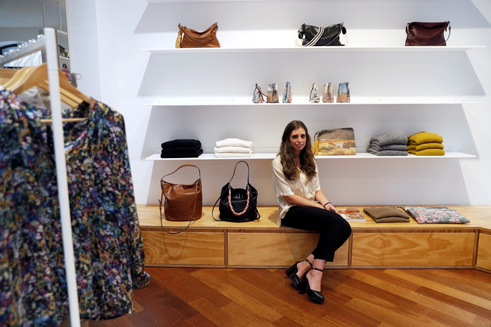Blanca Lorca poses in Zubi store, where she has bought some of her back-to-work apparel, in Madrid, Spain, September 15, 2021. Reuters/Susana Vera