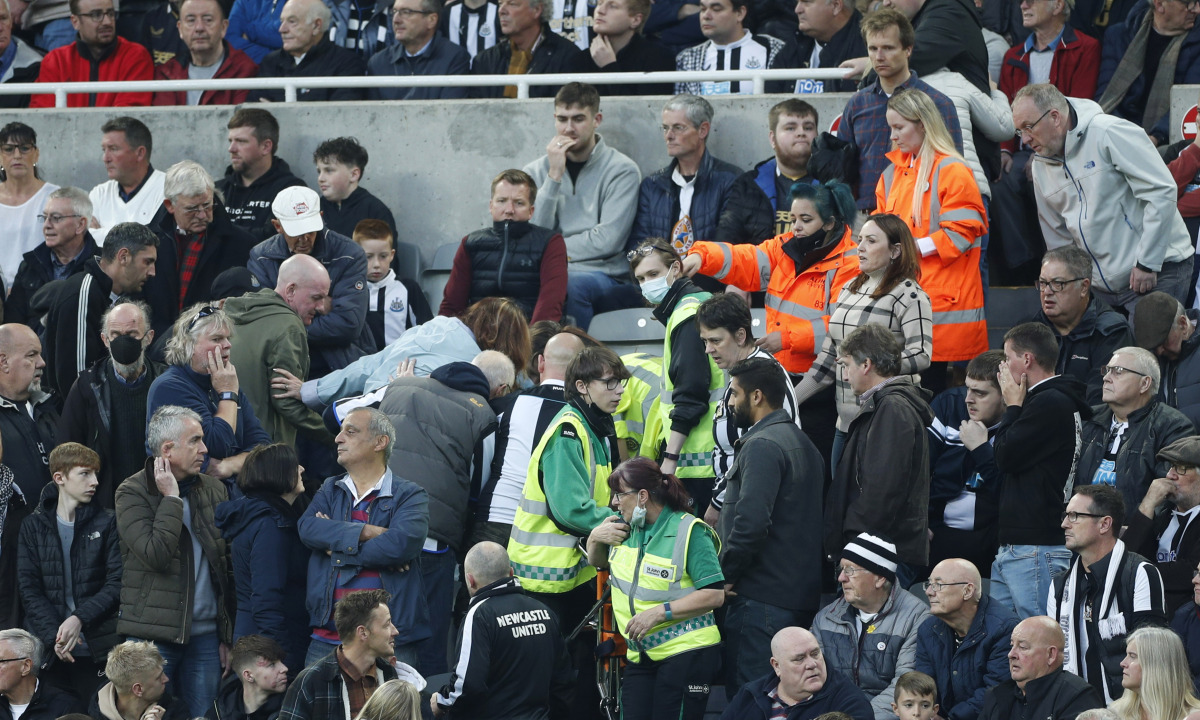 Newcastle fan in the stand is given emergency medical help Action Images via Reuters/Lee Smith