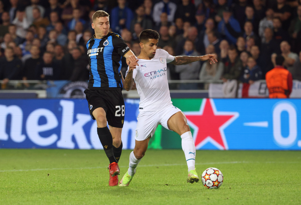 Manchester City's Joao Cancelo in action with Club Brugge's Ignace Van Der Brempt REUTERS/Yves Herman
