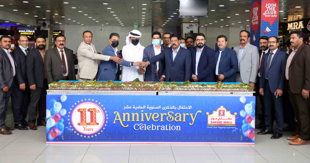 Management members and officials cutting a cake to mark Safari Mall's 11th anniversary.