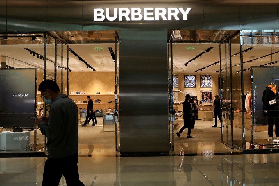A man walks past a store of luxury brand Burberry at a shopping mall in Beijing, China March 26, 2021. REUTERS/Tingshu Wang