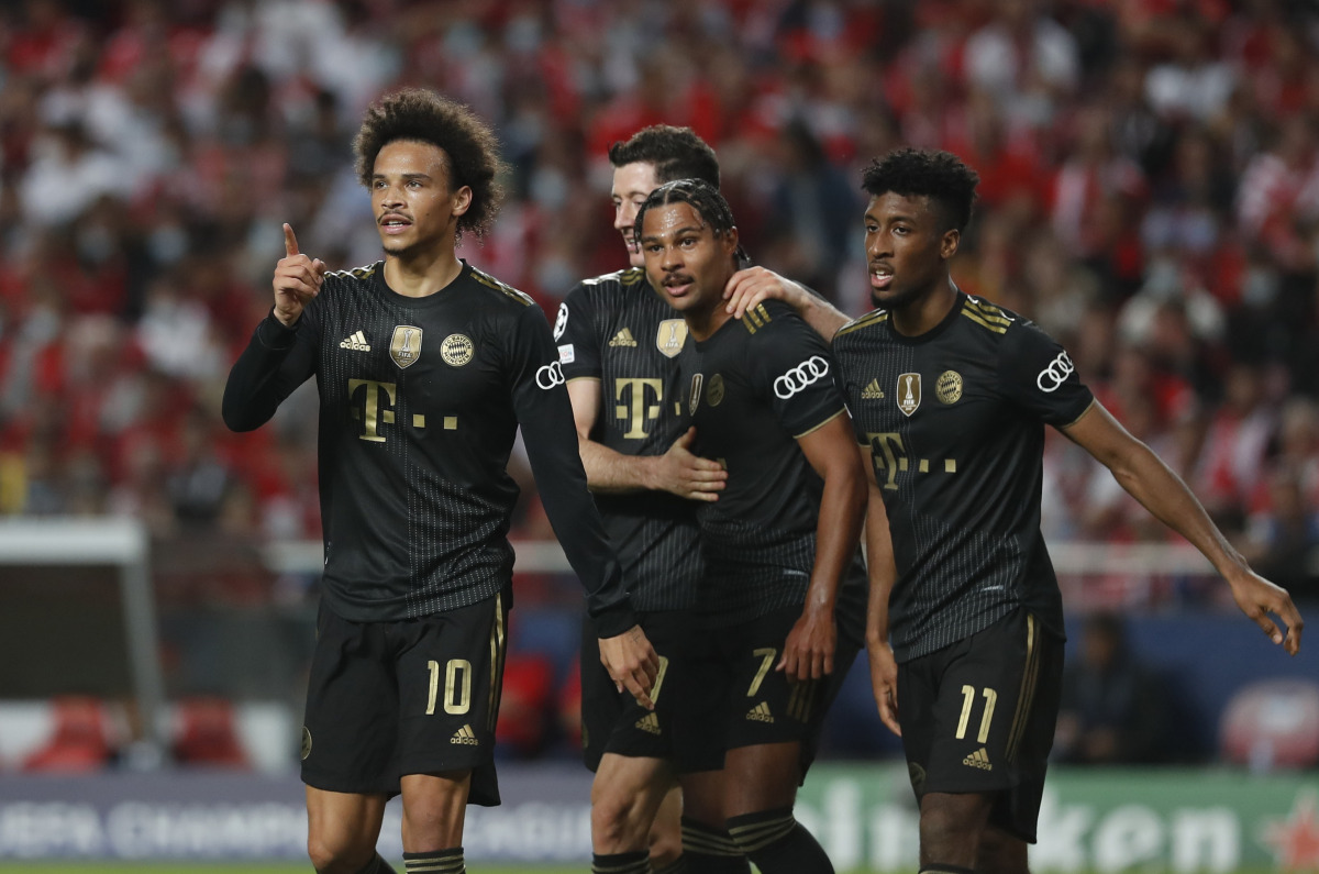 Bayern Munich's Leroy Sane celebrates scoring their fourth goal with Serge Gnabry , Robert Lewandowski and Kingsley Coman REUTERS/Pedro Nunes
