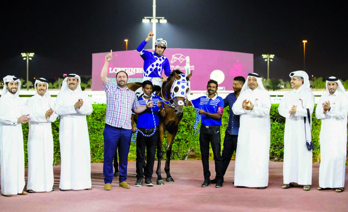 The connection of Taxiwala celebrate after winning the Sealine Cup at Al Rayyan Racecourse  yesterday.