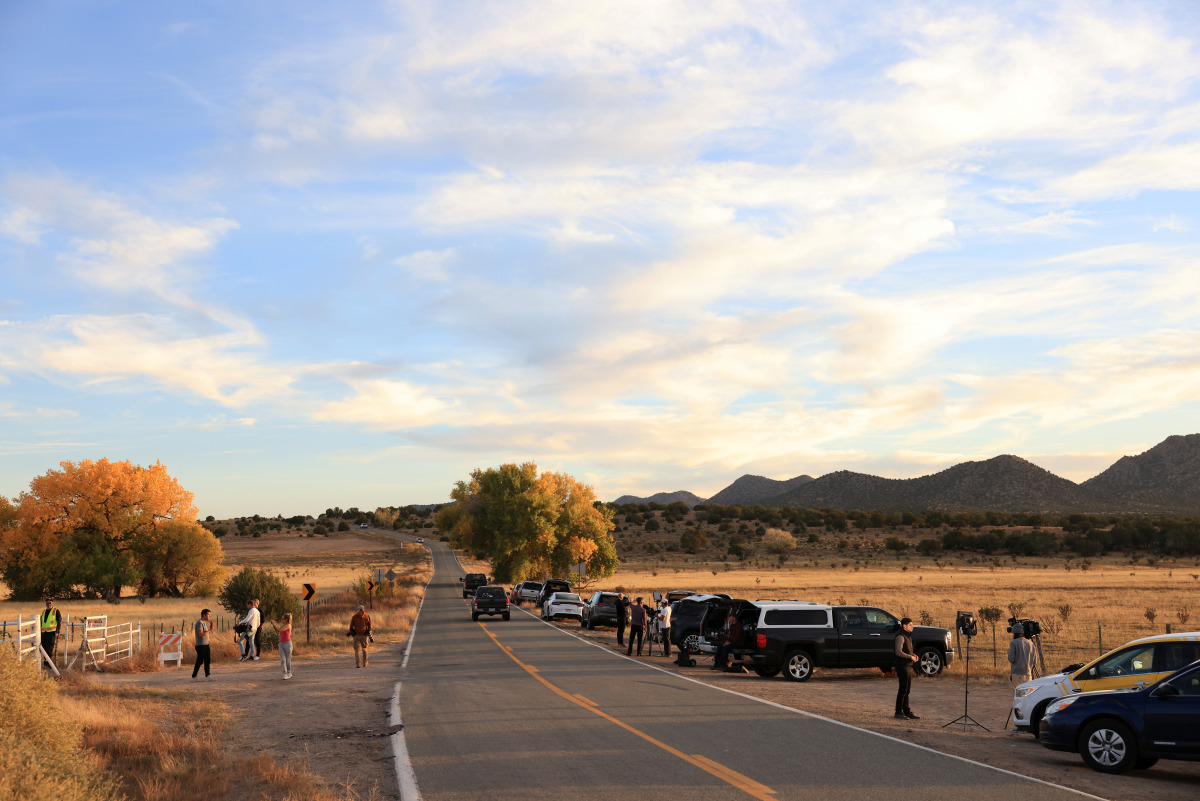 Media crews station themselves outside the gate of the film set of 