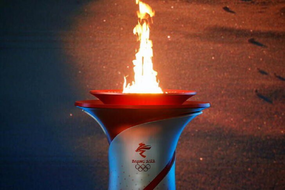 The Olympic flame burns in a cauldron at the ceremony to welcome the flame for the Beijing 2022 Winter Olympics, in Beijing, China October 20, 2021. REUTERS/Tingshu Wang