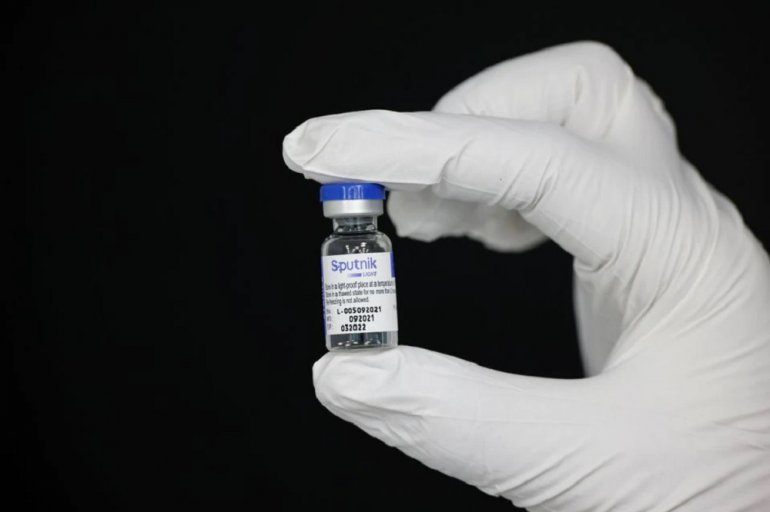 An employee holds a vial containing Sputnik vaccine at a factory of Hankook Korus Pharm, in Chuncheon, South Korea September 10, 2021. Picture taken September 10, 2021. REUTERS/Heo Ran