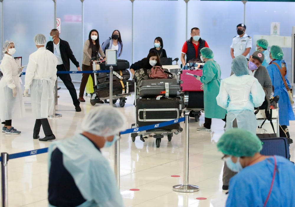 First group of foreign tourists arrive at Suvarnabhumi Airport during the first day of the country's reopening campaign, part of the government's plan to jump start the pandemic-hit tourism sector in Bangkok, Thailand November 1, 2021. REUTERS/Soe Zeya Tun