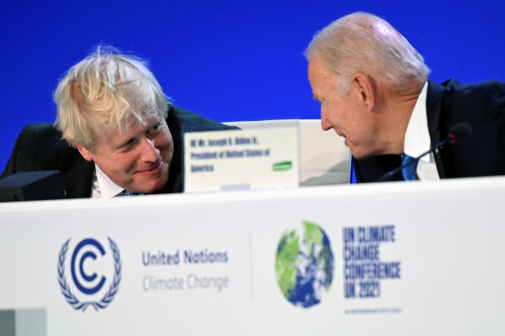 British Prime Minister Boris Johnson and US President Joe Biden react during the 