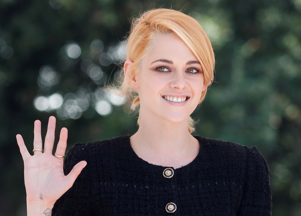Actor Kristen Stewart waves during the 78th Venice International Film Festival, in Venice, Italy, September 3, 2021. REUTERS/Yara Nardi
