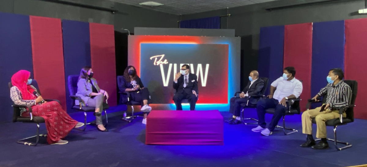 Parents interacting with the principal during an event at Ideal Indian School.