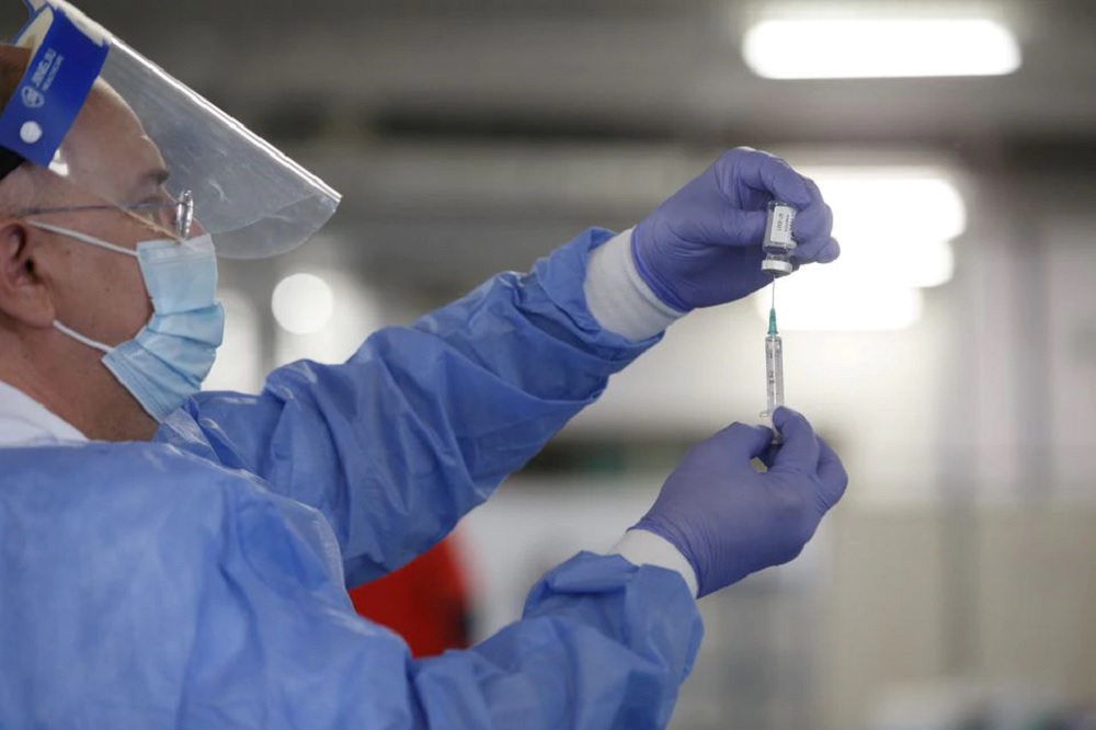 A medical worker prepares an injection with a dose of AstraZeneca COVID-19 vaccine, at a vaccination centre in Zagreb Fair hall, amid the outbreak of coronavirus disease (COVID-19), Croatia, April 7, 2021. REUTERS/Antonio Bronic