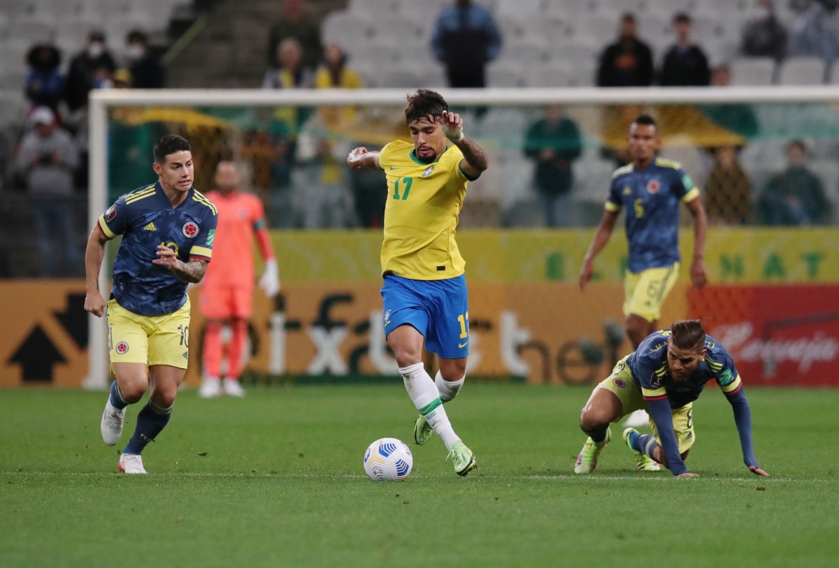 Brazil's Lucas Paqueta in action with Colombia's James Rodriguez REUTERS/Amanda Perobelli
