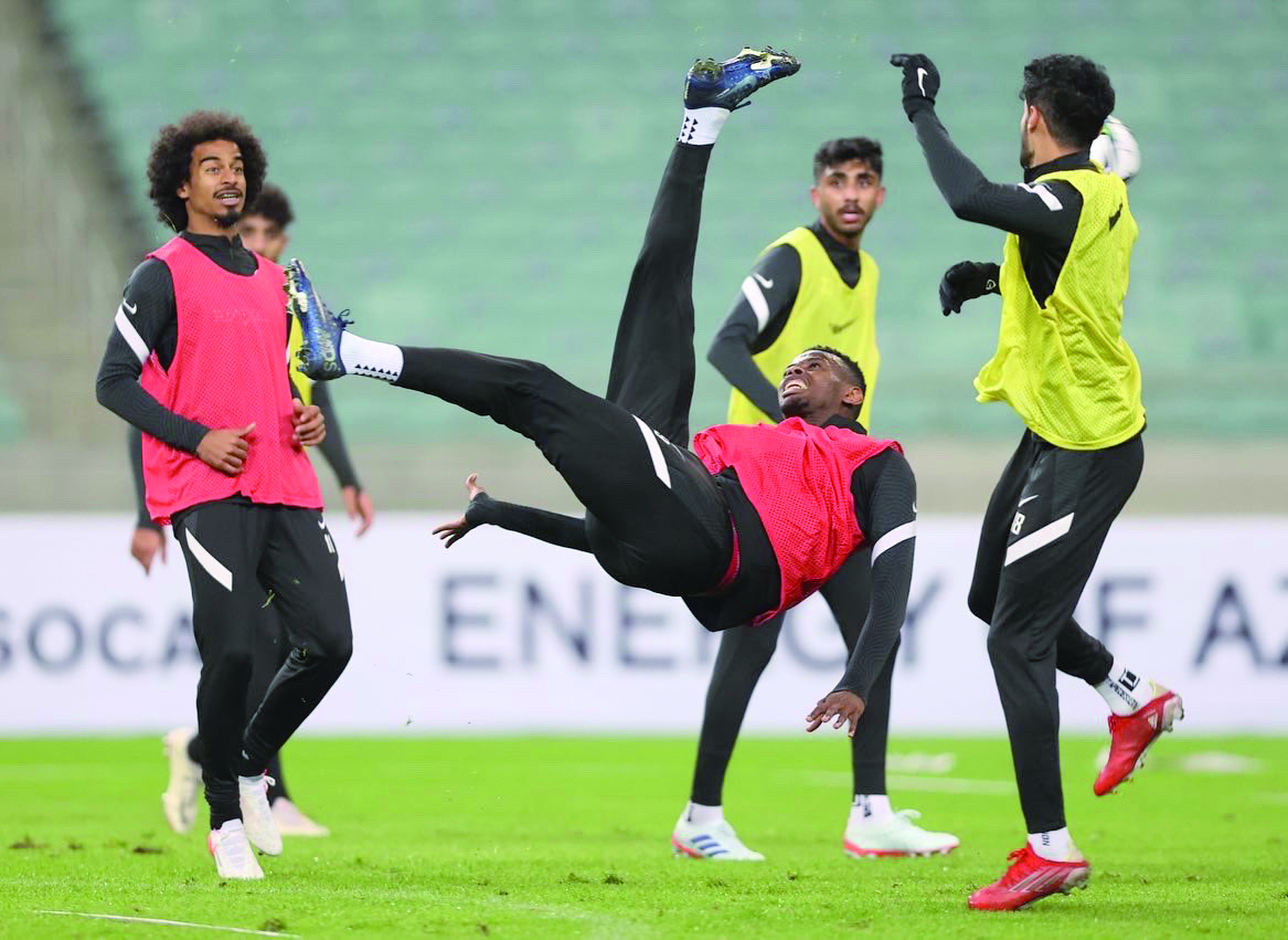 Qatar players in action during a practice session at Baku Olympic Stadium yesterday.