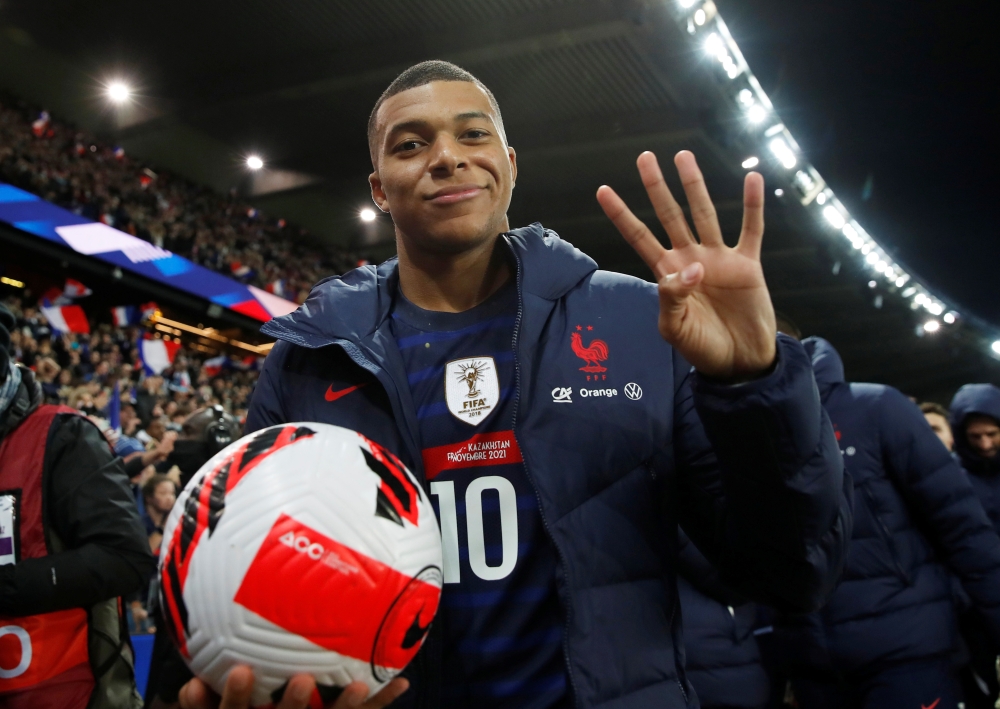 France's Kylian Mbappe gestures scoring four goals with the match ball as France qualify for the World Cup REUTERS/Gonzalo Fuentes 