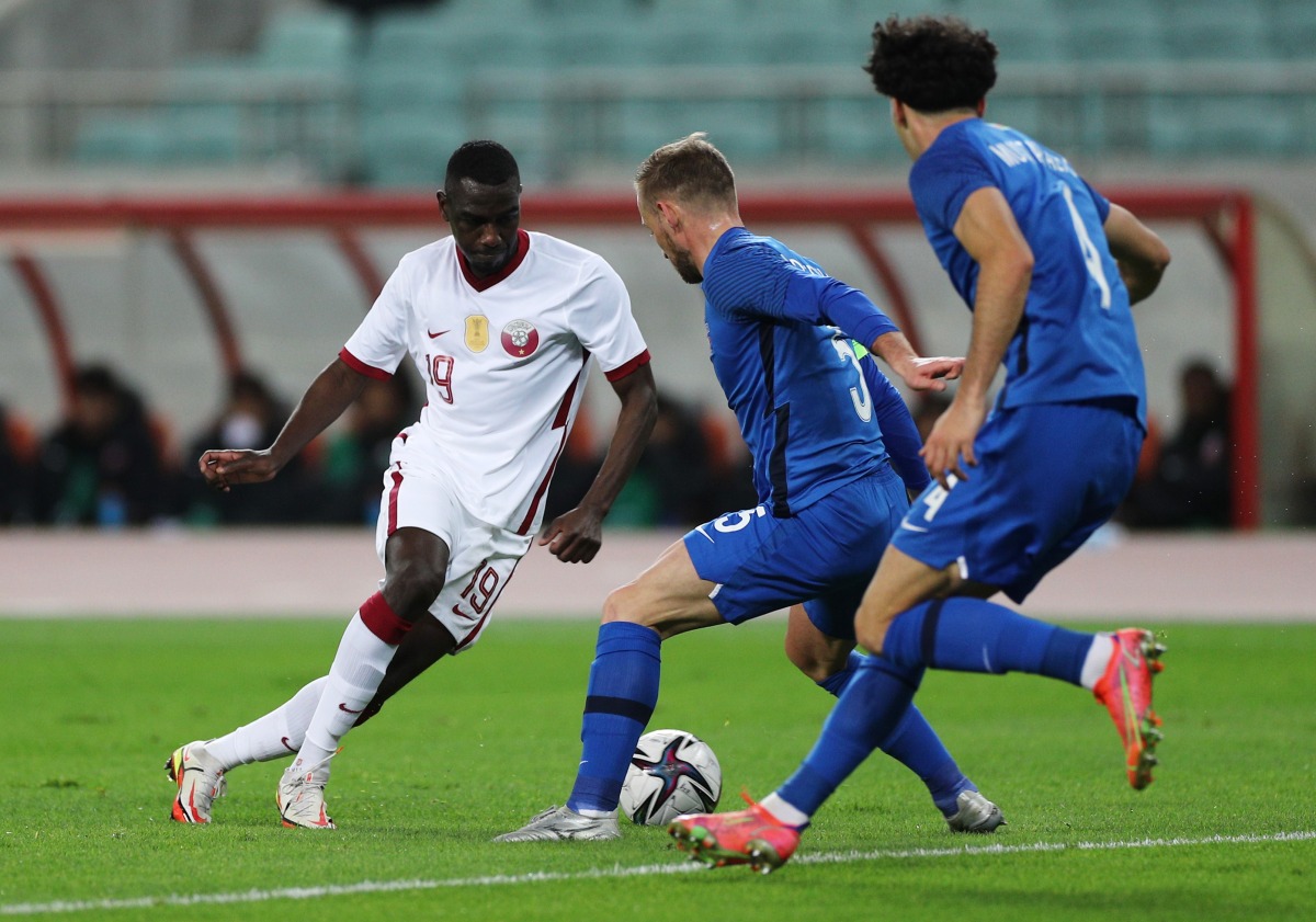 Qatar’s Almoez Ali vies for the ball with Azerbaijan’s Maksim Medvedev during yesterday's European Qualifier.