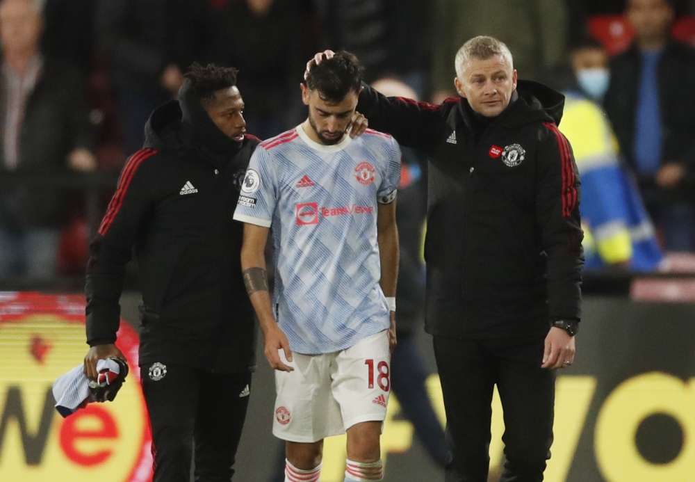 Manchester United manager Ole Gunnar Solskjaer and Bruno Fernandes look dejected after the match Action Images via Reuters/Matthew Childs