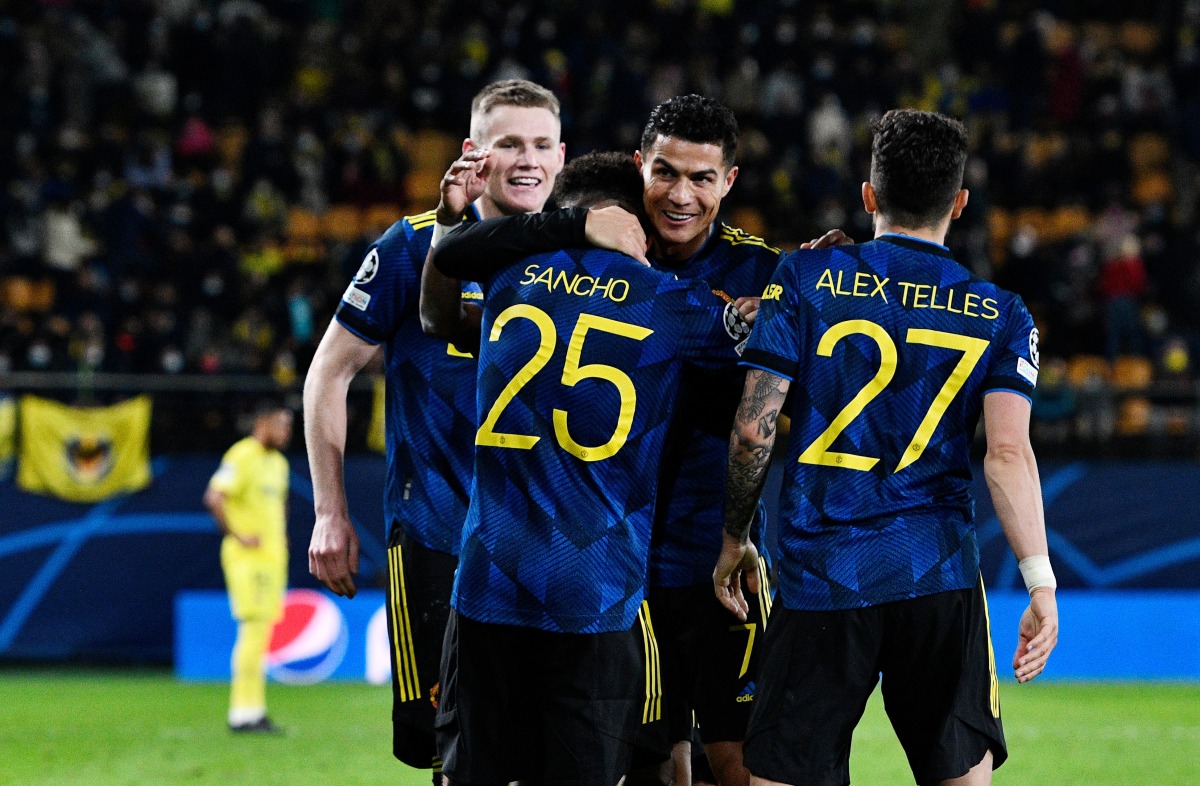 Manchester United's Jadon Sancho celebrates scoring their second goal with Cristiano Ronaldo REUTERS/Pablo Morano
