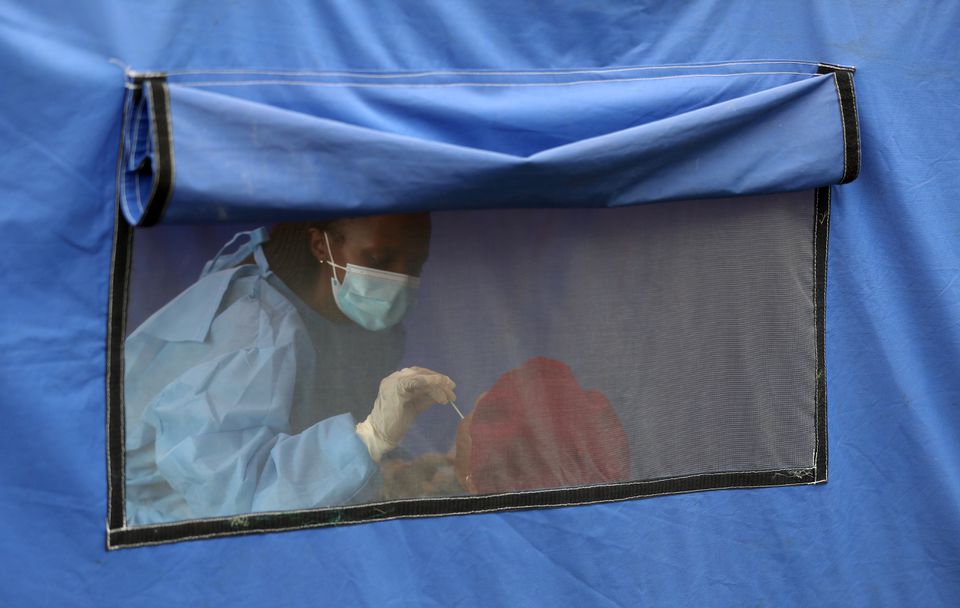 A traveller is tested for the coronavirus disease amid a nationwide COVID-19 lockdown, at the Grasmere Toll Plaza, in Lenasia, South Africa, January 14, 2021. REUTERS/Siphiwe Sibeko


