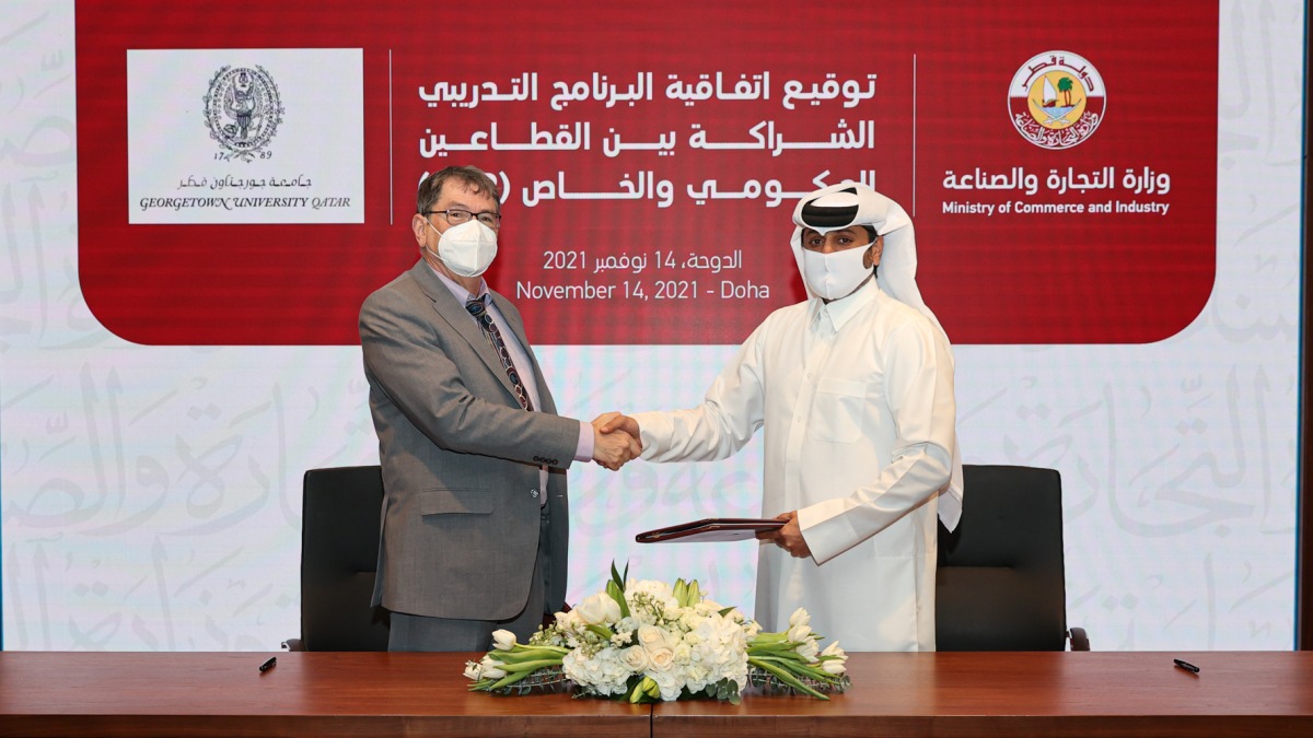 Nasser Al Muhannadi, Director of Finance and Administrative Affairs at MoCI, and Dr. Clyde Wilcox, Dean of Georgetown University in Qatar, during the signing ceremony.