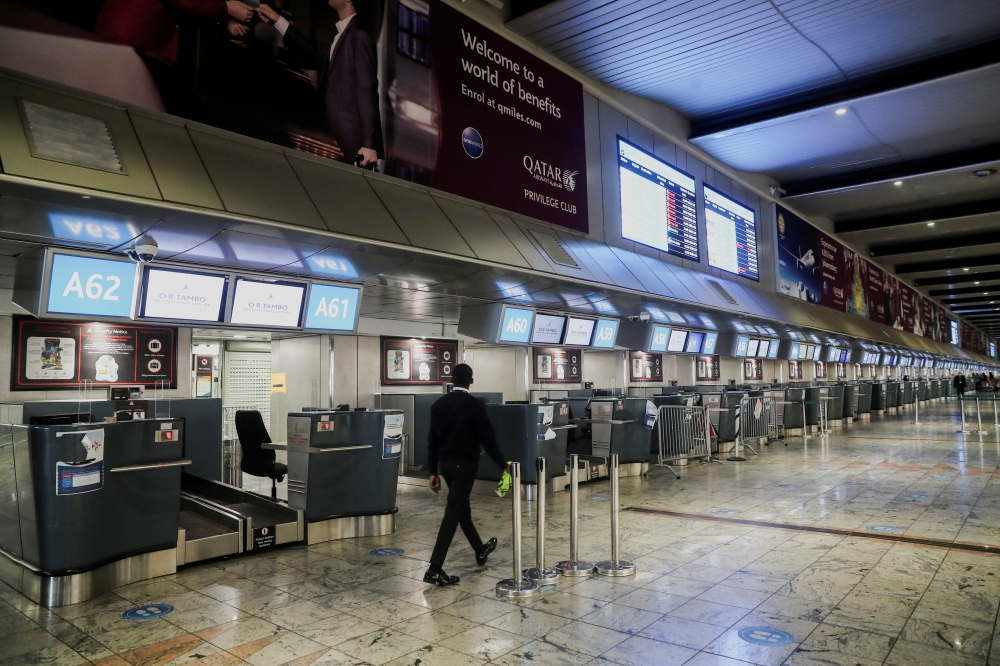 International check-in counters stand empty amidst the spread of Omicron, at O.R. Tambo International Airport in Johannesburg, South Africa, November 28, 2021. Reuters/ Sumaya Hisham/File Photo