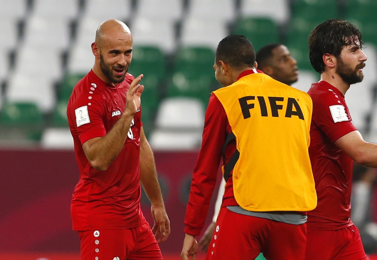 File photo of Palestine’s defensive midfielder Mohammed Rashid (left) gestures during the Group C match against Saudi Arabia