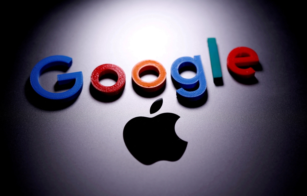 A 3D printed Google logo is placed on the Apple Macbook in this illustration taken April 12, 2020. REUTERS/Dado Ruvic/Illustration/File Photo